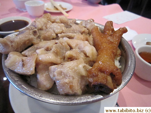 Pork ribs and chicken feet over rice
