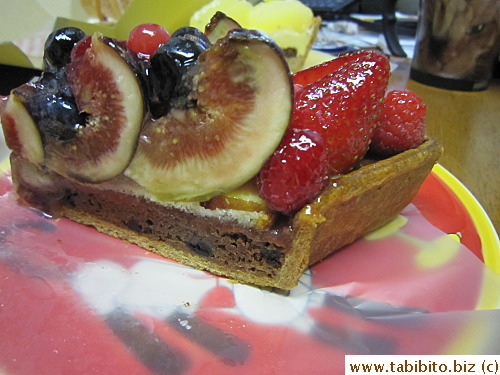 Fresh and juicy fruit topped a chocolate chip chocolate mouse in a crispy flaky tart shell