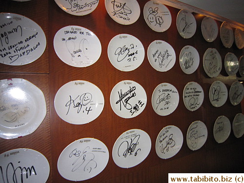 Autographed plates decorate the entrance walls