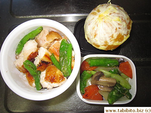 Panfried chicken and shishito peppers, stirfried mixed veggies, orange