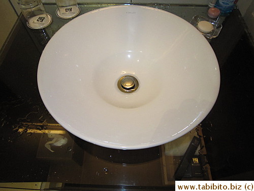 The sink may be stylish and chic, but the faucet is too close to the top edge of it and...