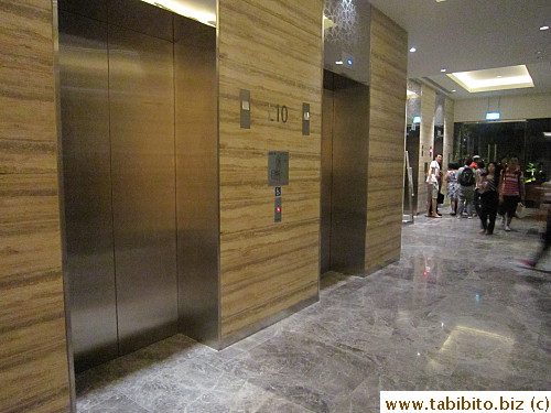 Elevators for guest rooms are located behind the reception desk 