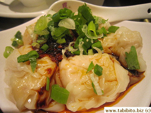 Pork dumplings in a spicy sauce wasn't spicy but weirdly sweet