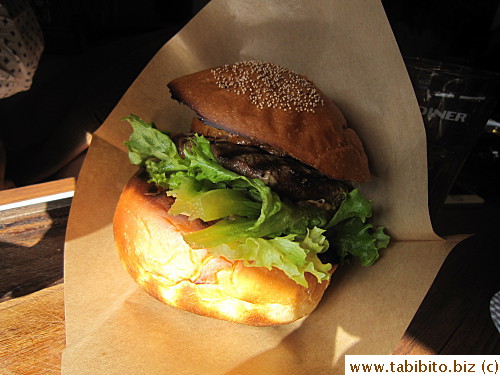 Burgers often come with a paper pocket so you don't get juices all over your hands